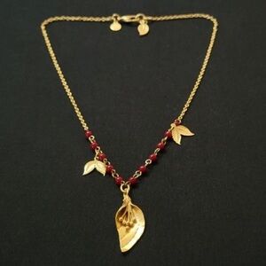 David Audrey Elegant Gold Tone Leaf Necklace with Red Accents